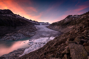 dramatic colored clouds at sunset over Rhoneglacier