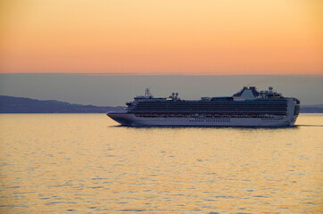 Dream cruise on luxury modern cruiseship or cruise ship liner at sea during sunset or sunrise or...