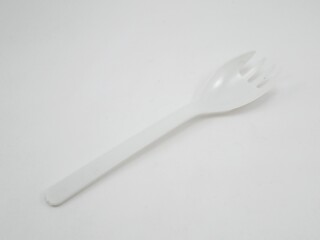 White spoon plus fork design utensil
