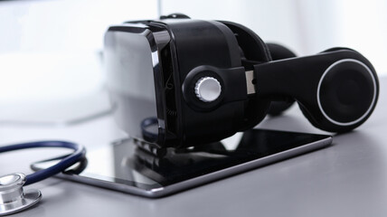 Virtual reality goggles on desk with laptop. business. 3d technology