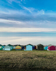 Grassy hill and huts on the beach