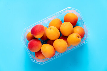 peaches in plastic packaging from a supermarket.