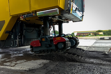 Obraz premium Heavy construction equipment working to widen a roadway 