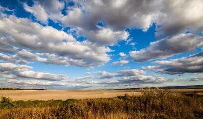 Blue Sky and Clouds Above Fields