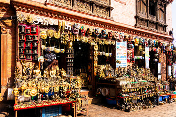 KATHMANDU, NEPAL - NOV 22, 2018: Shop of traditional Nepalese handicrafts and Religious statues,...