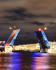 Fototapeta na wymiar Divorsed palace bridge in Saint-Petersburg at night on long exposure