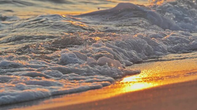 beach wave splashing macro in sunset 4k