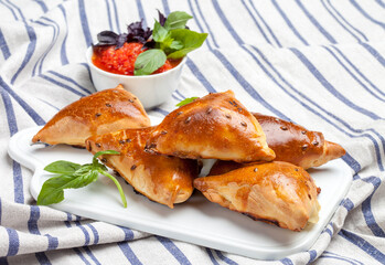 Delicious samosa on a tablecloth background