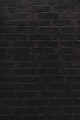 brick wall texture. black background of a old brick house.