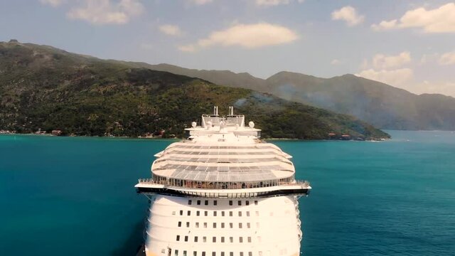 drone footage of a cruise ship in the ocean