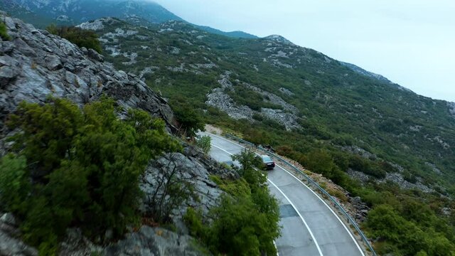Driving through mysterious mountains in Karlobag, Croatia. Aerial reveal of landscape