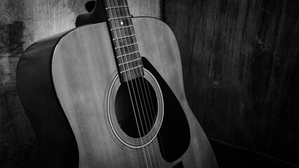 Obraz premium Acoustic guitar, black and white photo, musical instrument and strings.
