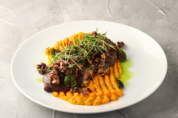 pumpkin mashed with beef and microgreen closeup