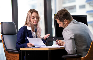 businessman and businesswoman in office