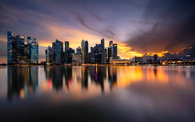 Fototapeta na wymiar Singapore Downtown Skyline with Colorful Sunset Sky in Summer