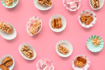 Crispy rice bars with marshmallow on color background