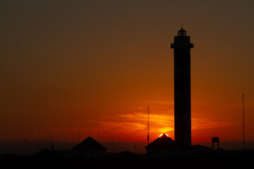 sunset behind the lighthouse