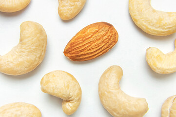 Creative food layout. Cashew on white background top view copy space. Concept of food, healthy nutrition, nut, healthy fats. Flat lay. Cashew pattern. Organic healthy vegan snack macro shot