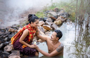 sexy asian women and man bathing water in river at countryside of Thailand