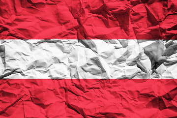 National flag of Austria on crumpled paper. Flag printed on a sheet. Flag image for design on flyers, advertising.