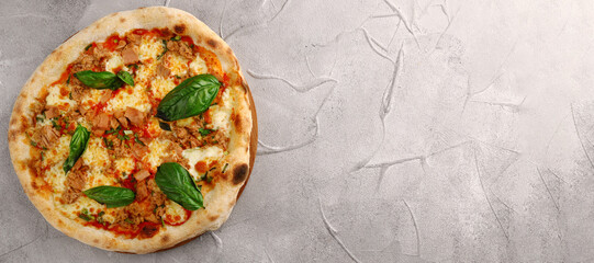 pizza with tuna mozzarella, onion and basil banner on light concrete or stone table top view