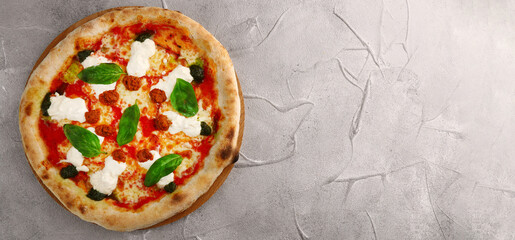 strachatella pizza banner on light concrete or stone background. pizza with meat, pesto, tomatoes and stracciatella cheese top view
