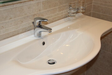 Modern white sink in the bathroom. Interior item