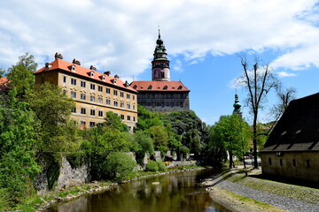Renaissance Krumlov Castle on a sunny day on a steep rocky promontory washed by the Vltava River