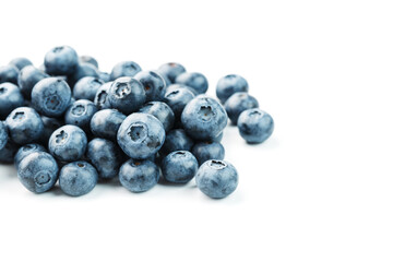 Blueberries are scattered on a white background. Free space, isolate. Studio light.