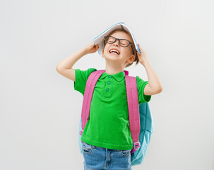 Kid with backpack on white background.