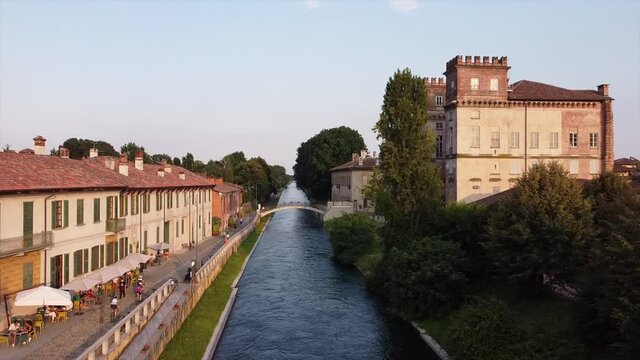 Europe, Italy , July 2020 - Drone aerial view of Robecco sul Naviglio: a little countryside village near Milan famous for Leonardo's locks - bridge and Navigli canals waterway in Ticino natural park