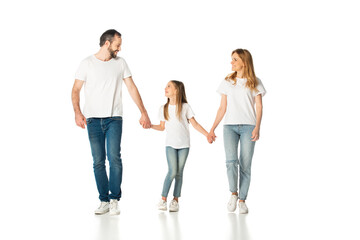 Fototapeta premium happy casual family holding hands while walking isolated on white
