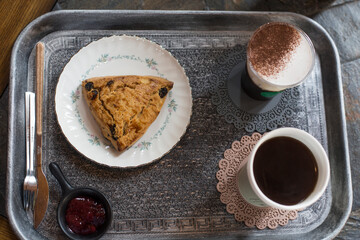 Coffee and Scones on a silver tray.