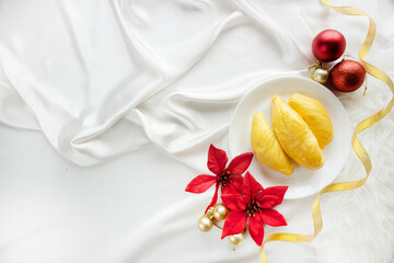 Christmas in Asia. Celebrate Christmas with Durian. Durian Flatlay on White Background.