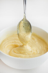 Swirls of Durian Paste on a White Table. Singapore Durian Mousse Dessert. Mao Shan Wang Durian Paste with Copy Space