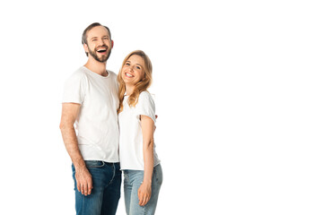 Fototapeta premium happy adult couple in white t-shirts embracing isolated on white