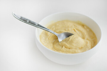 Swirls of Durian Paste on a White Table. Singapore Durian Mousse Dessert. Mao Shan Wang Durian Paste with Copy Space