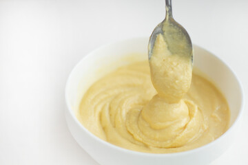 Swirls of Durian Paste on a White Table. Singapore Durian Mousse Dessert. Mao Shan Wang Durian Paste with Copy Space