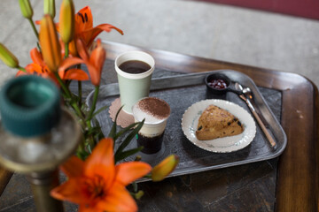 Coffee and Scones on a silver tray.