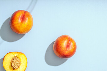Peach or nectarine and peach slice with leaf on white background