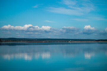 Obraz na płótnie Canvas blue sky and clouds at the lake