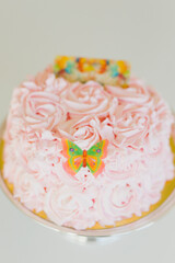 Pink Birthday cake decorated with pink flowers