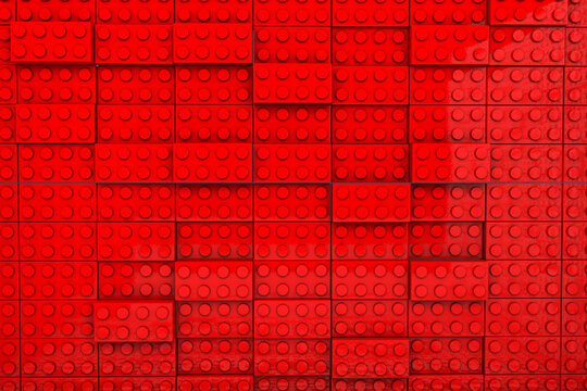 3d rendering of toy bricks on red background. 
minimalistic background. Wide background site head and cover photo. Pattern for texture of wallpaper.
