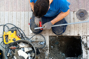 plumber worker repair and replace plastic water pipes because of a break in pipes