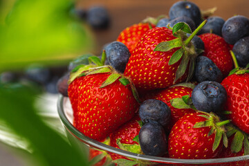 Fresh ripe strawberry and blueberry in bowl