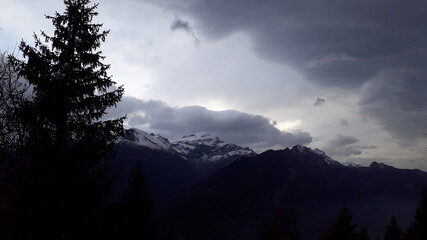 Obraz premium Nature and clouds and trees. silhouette of mountains