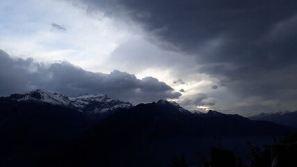 Nature and clouds and trees. silhouette of mountains