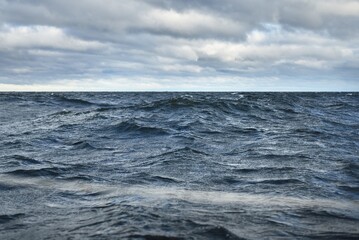 North sea under the dark clouds after the thunderstorm. A view from the sailing boat. Dramatic...