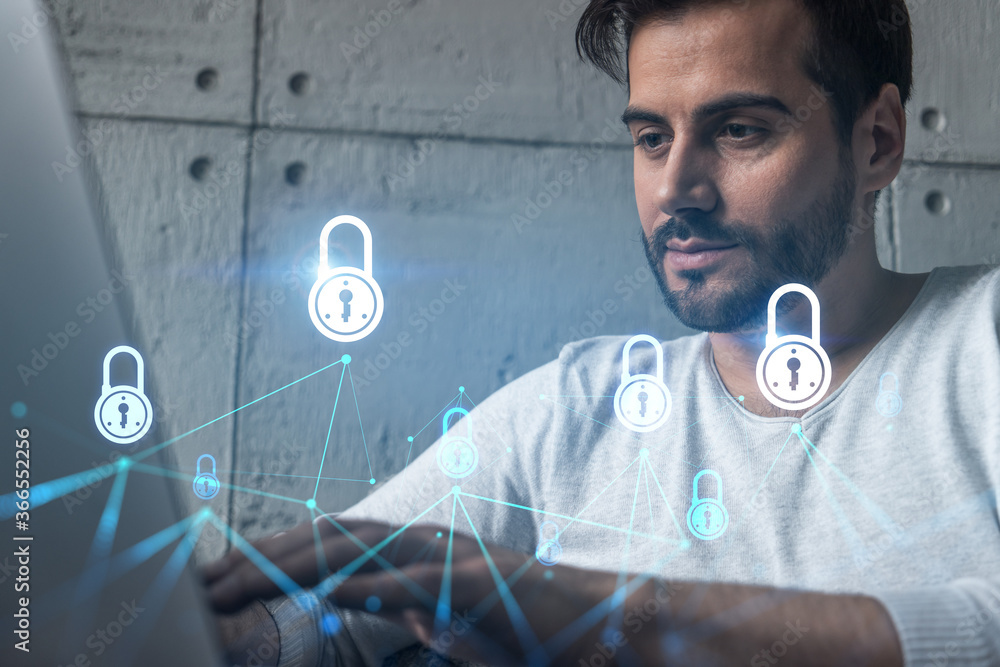 Poster a serious caucasian programmer in casual wears, using laptop to develop a new security system to pro