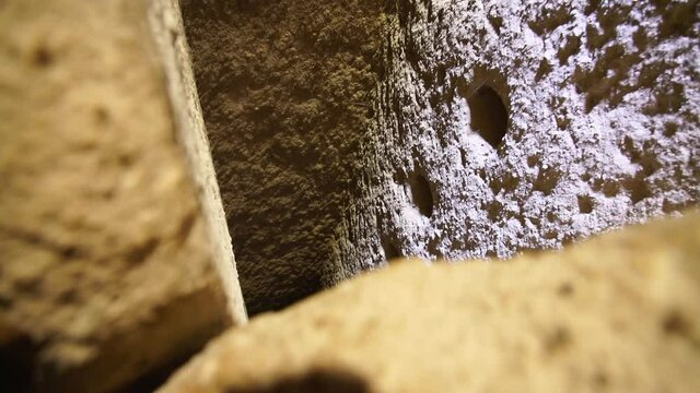 Deep Infinite black void, Ventilation Shaft In Kaymakli Underground City, Derinkuyu, Cappadocia,  historic Turkey - revealing dark, deep hole